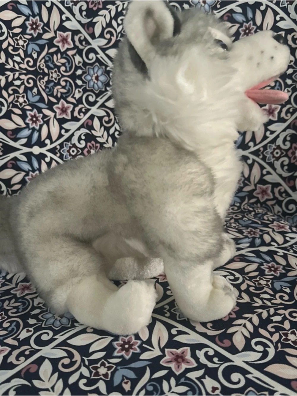 Siberian Husky dog toy with blue eyes and a happy open mouth showing its tongue